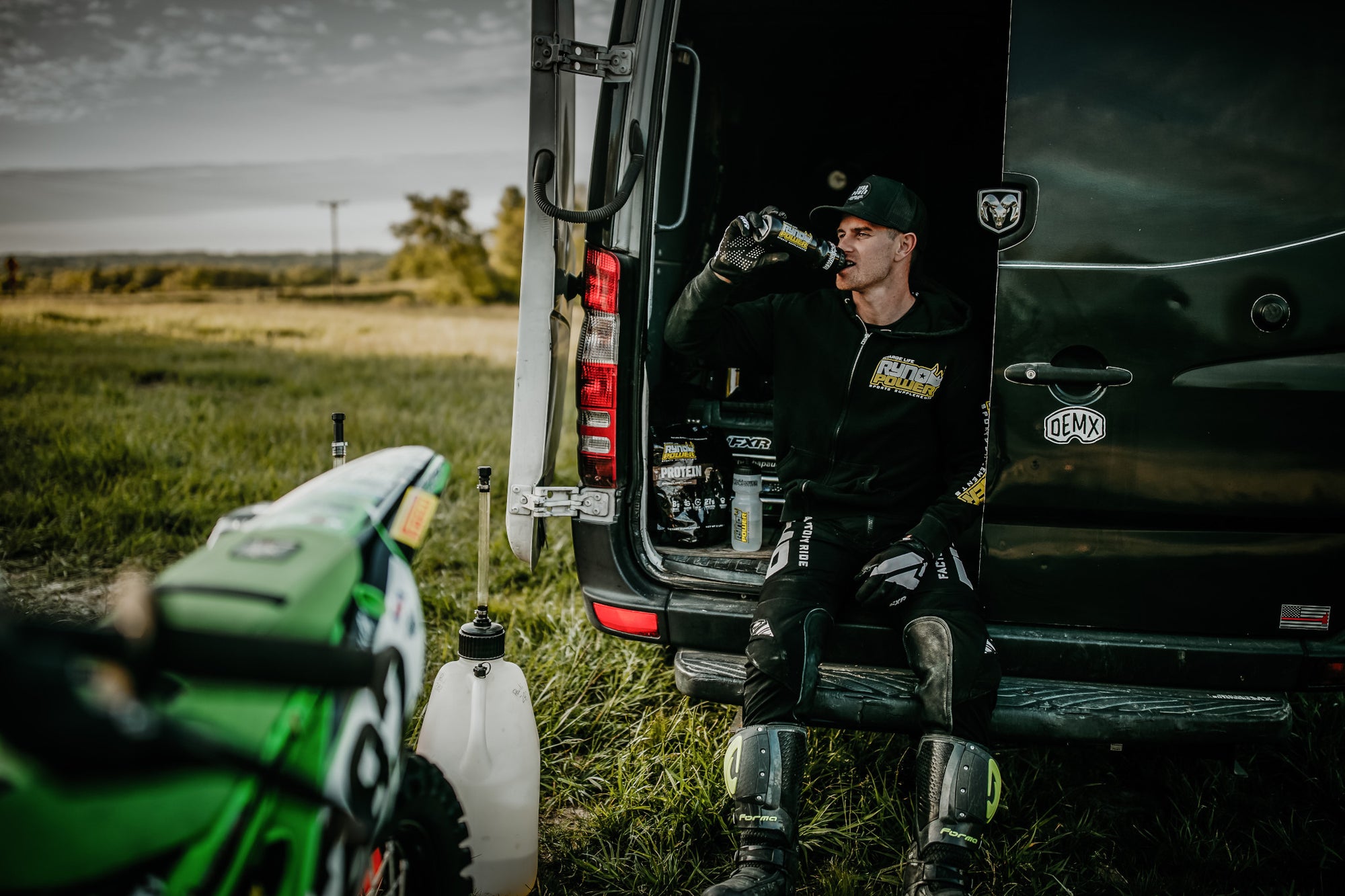 person sitting drinking from bottle